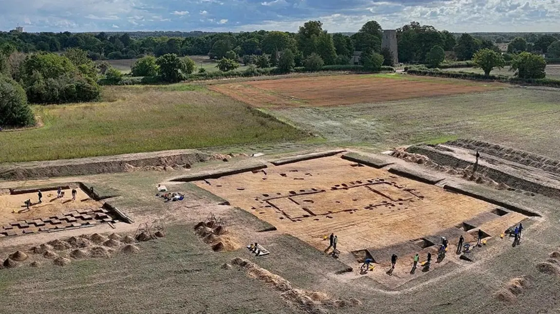 An aerial photo of an archaeological dig in a field