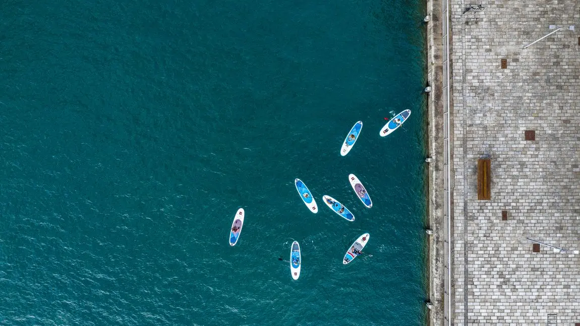Paddleboarders in Royal William Yard, Plymouth Paddleboarders in Royal William Yard, Plymouth