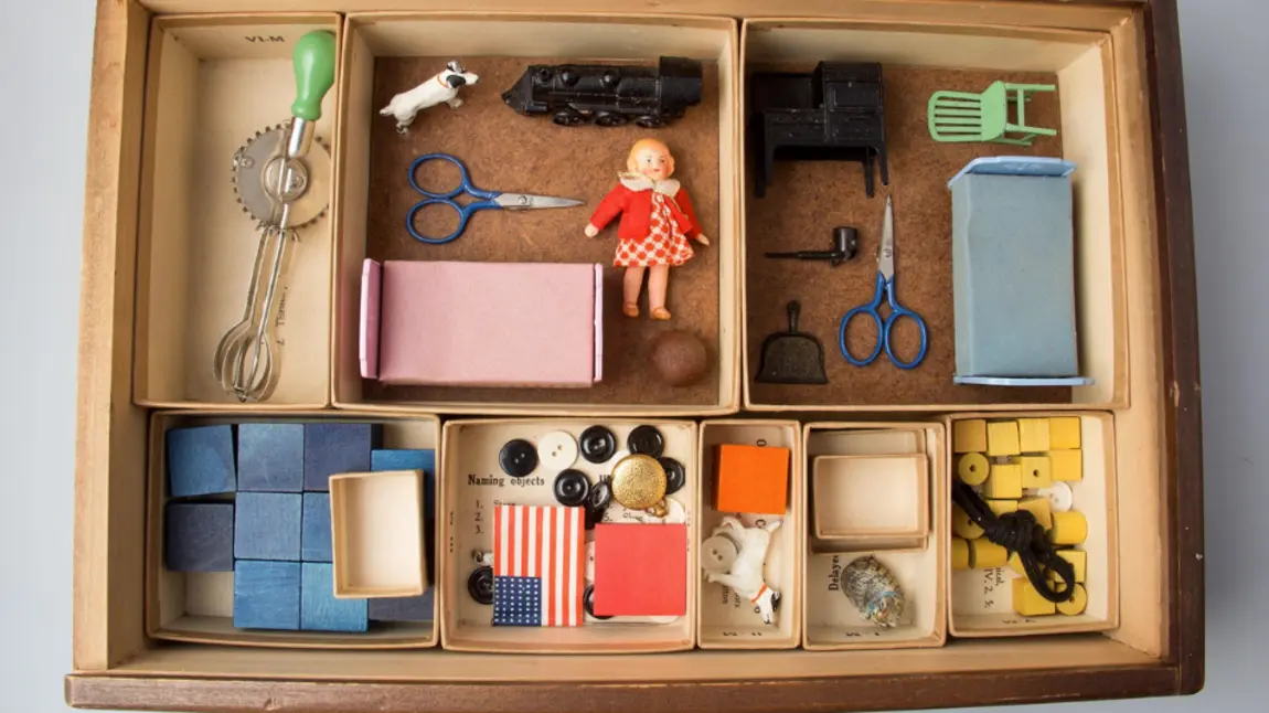 Photograph of various items in a wooden box