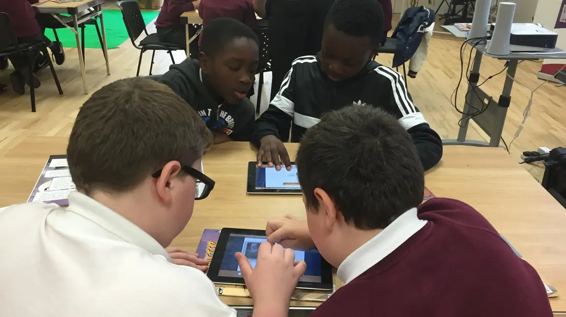 Young people developing graphic novels about history on ipads