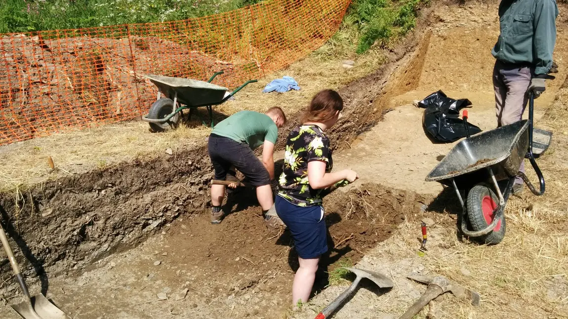 Jamie working on an archaeological dig site Jamie working on an archaeological dig site