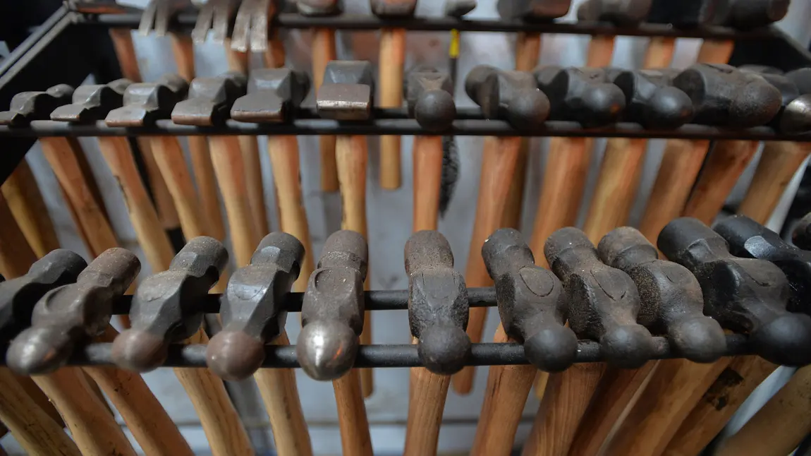 A rack of blacksmith tools A rack of blacksmith tools