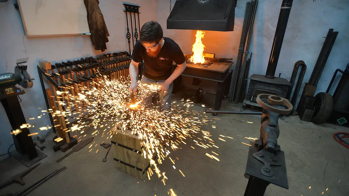 Life-changing: from Belfast welder to heritage blacksmith Owen at work on his anvil