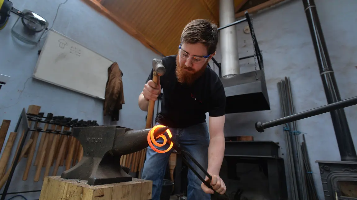 Owen at work in his workshop Owen at work in his workshop