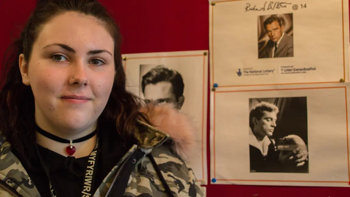 Changing lives: instilling confidence in Port Talbot teens Shania in front of the students' display