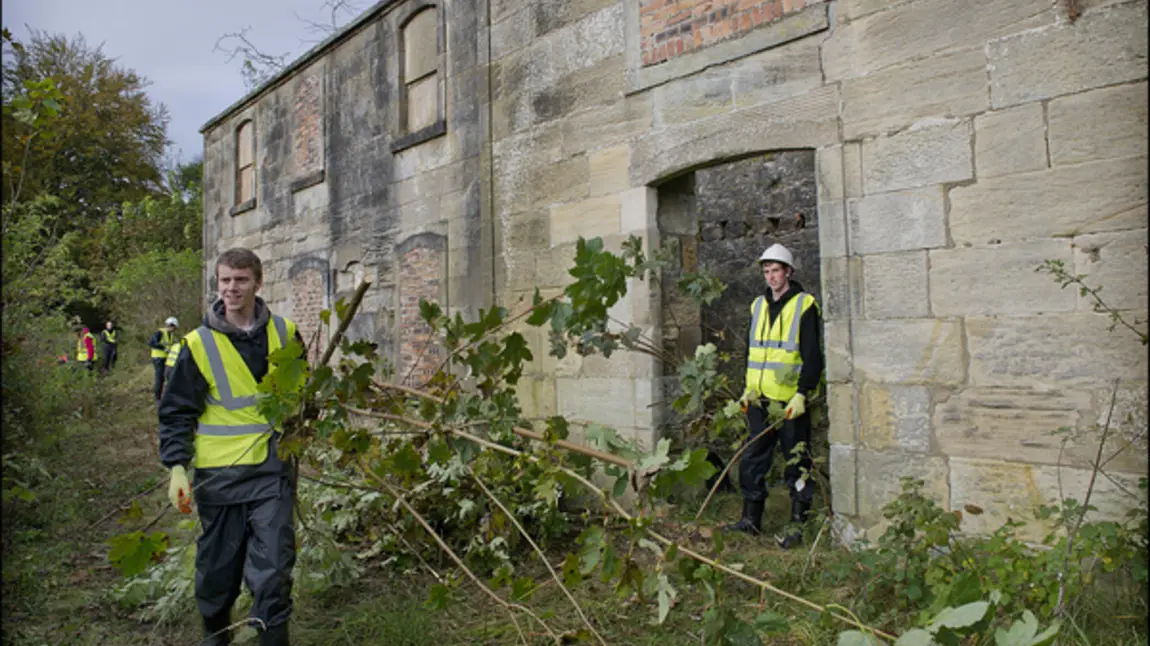 Two young men volunteering at Canal College