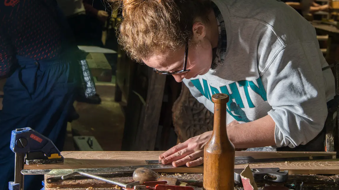 A woman does woodwork A woman does woodwork