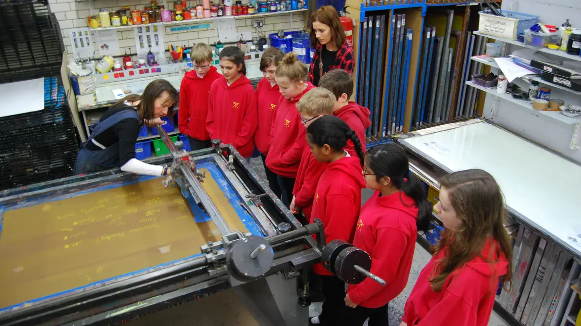 HLF puts some Welly into Regeneration Primary schoolchildren being demonstrated the art of printmaking