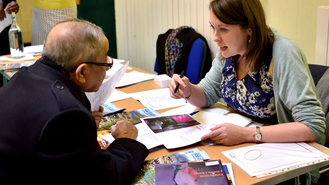 HLF staff member speaking to applicant at an event