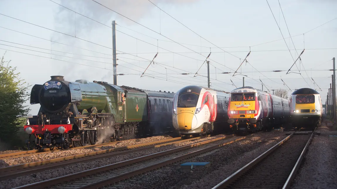 The Flying Scotsman alongside modern train stock The Flying Scotsman alongside modern train stock