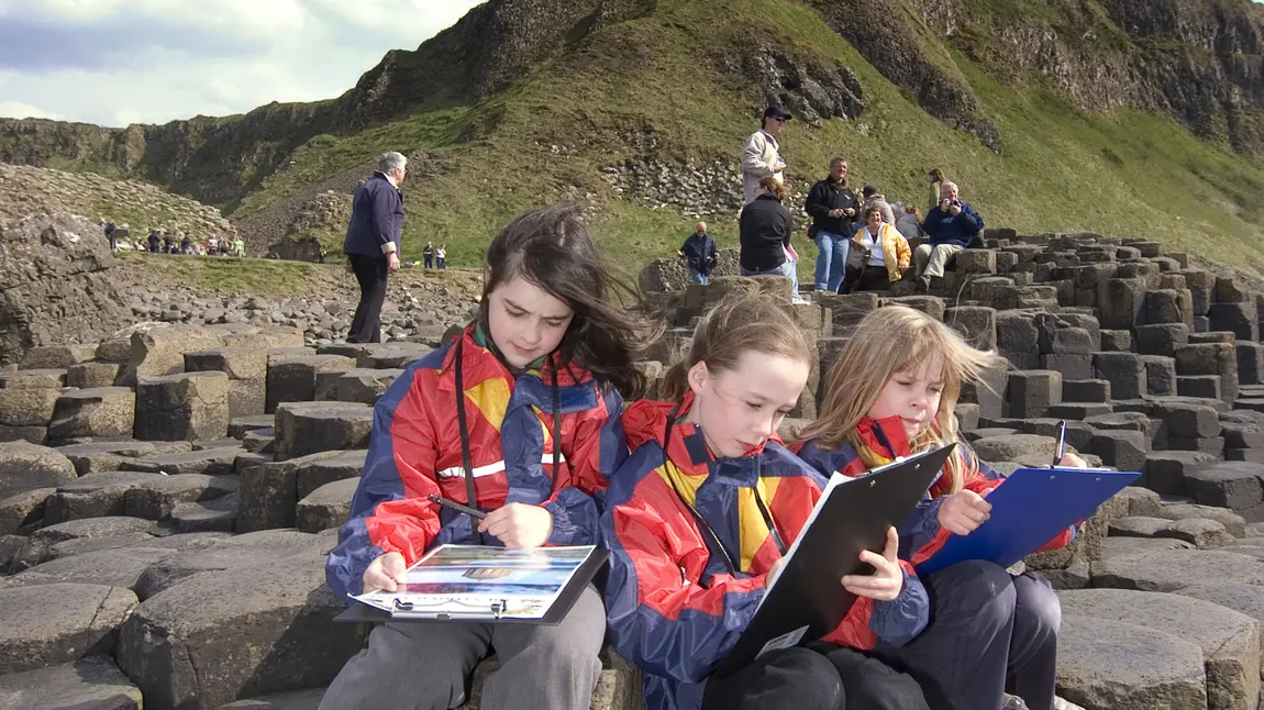 Celebrating World Heritage Day children at Giant's Causeway, Northern Ireland