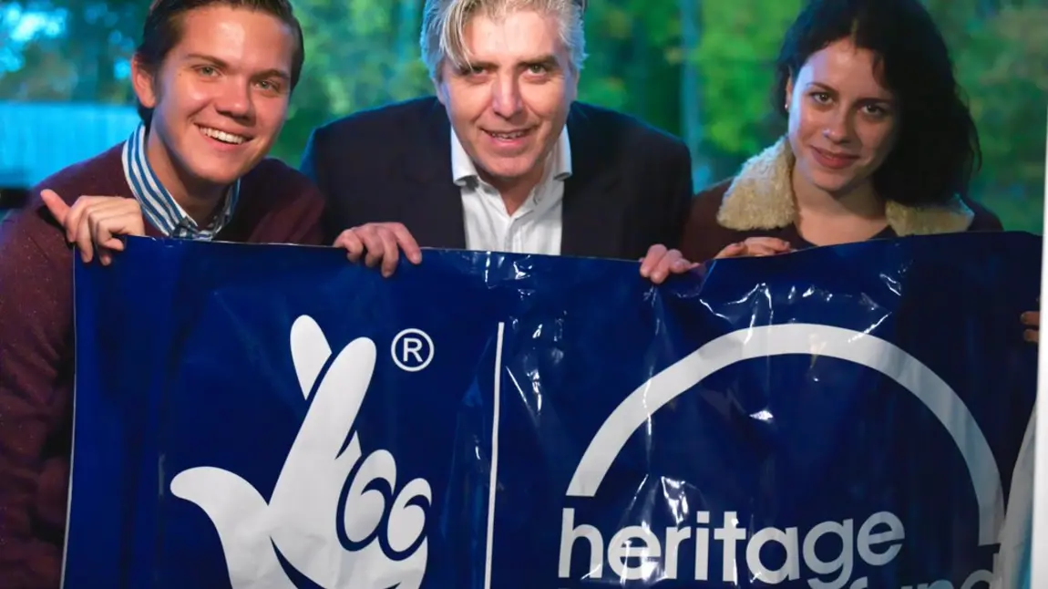 Mike Flack, David Hevey and Georgia Macqueen Black with HLF banner
