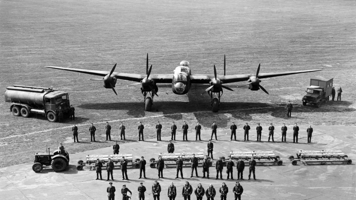 Units from Bomber Command line up in front of a Lancaster Bomber