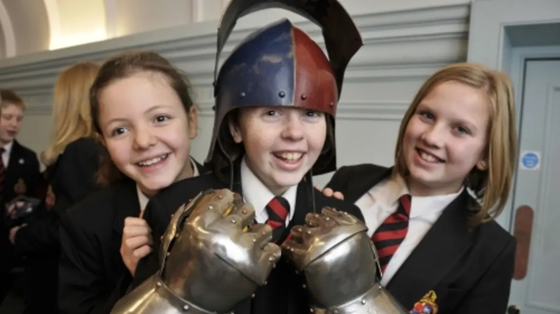 Children try on armour