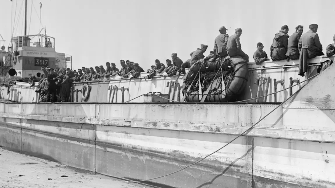 German prisoners await passage to England in a Landing Craft Tank