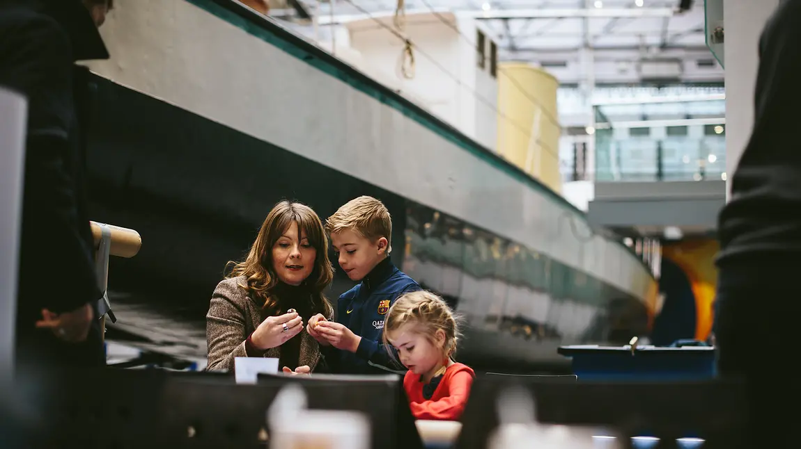 A family enjoys Discovery Museum