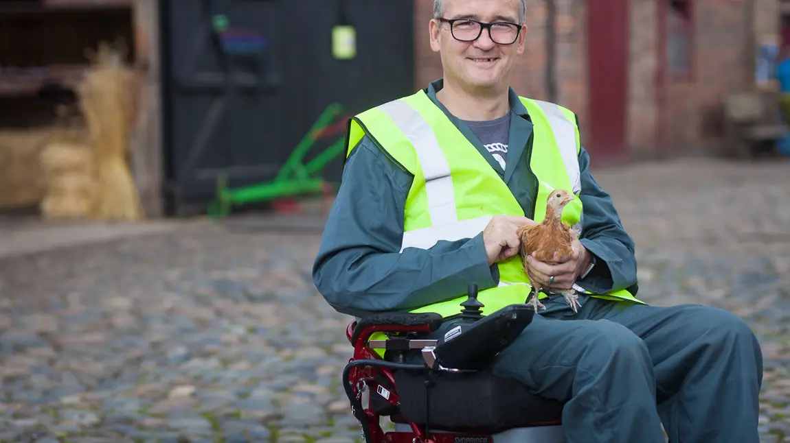 Changing lives: how volunteering helped Nick find purpose again Man with chicken