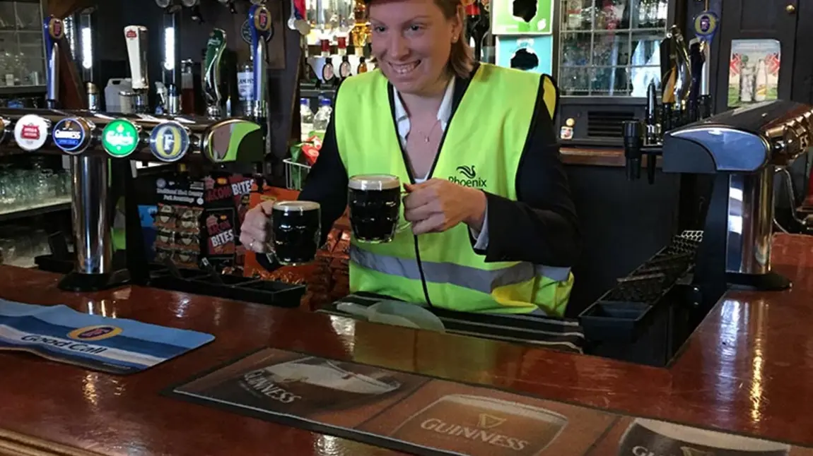 Heritage Minister Tracey Crouch pulling pints at The Fellowship Inn, Bellingham, South London