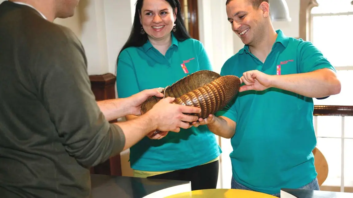 Volunteers showing handling objects at the Migration Museum