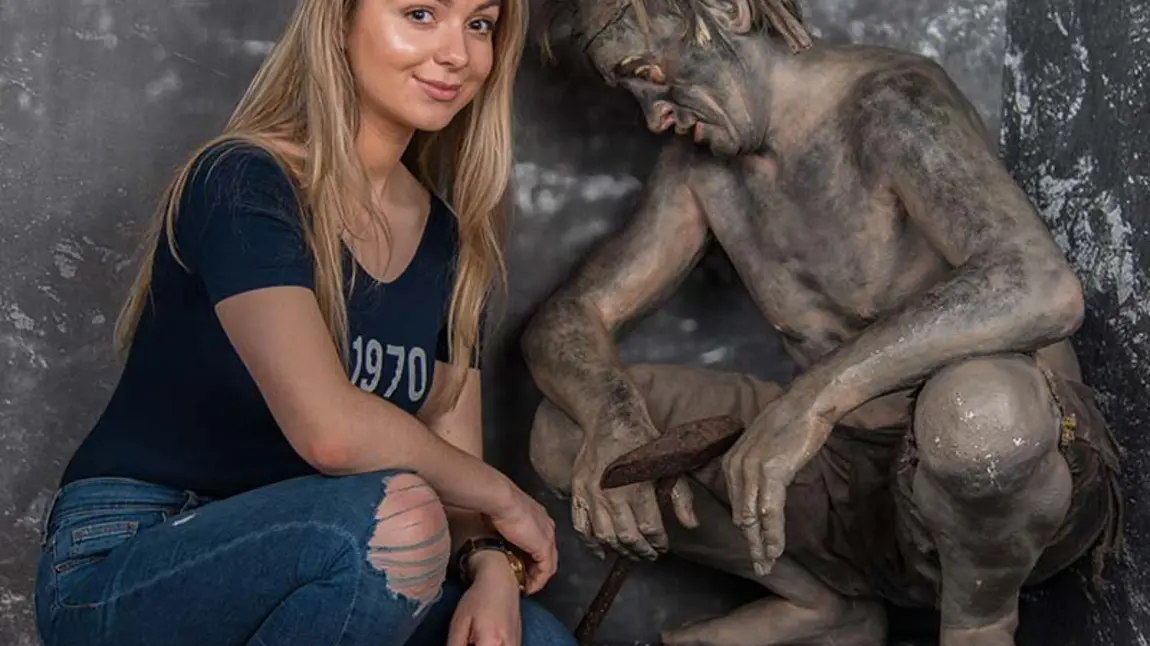 Jasmine with the statue of a miner at the Low Parks Museum, South Lanarkshire