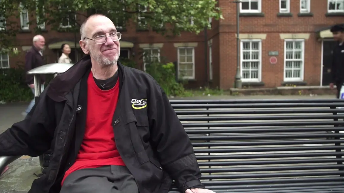 John sits on the bench he used to sleep on John sits on the bench he used to sleep on
