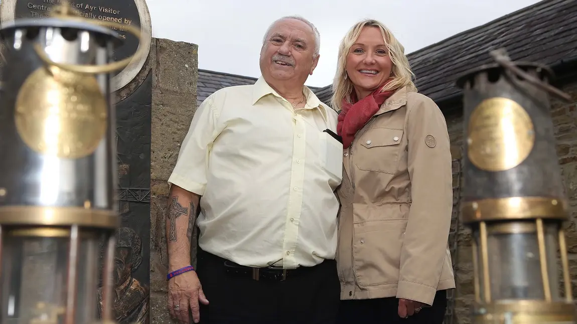 Mining memories saved thanks to National Lottery surprise John Wiltshire being presented with a cheque by Vicky Peterson