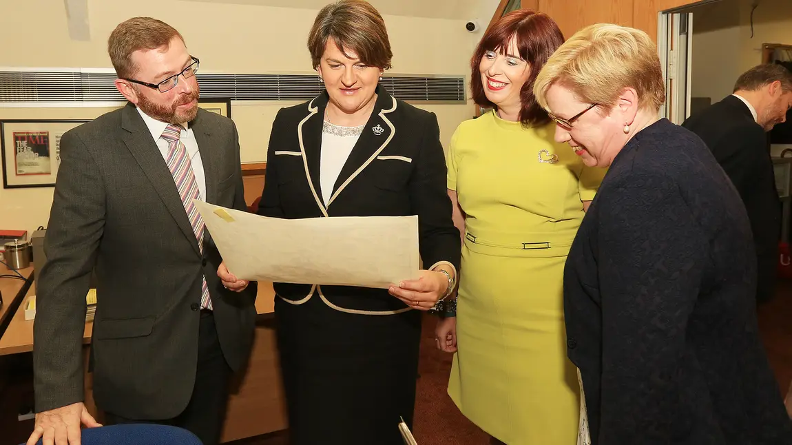 Digitising a divided society at Linenhall Library HLF NI Committee Member Mark Glover, First Minister Arlene Foster, Linenhall Library Director Julie Andrews at Linenhall Library