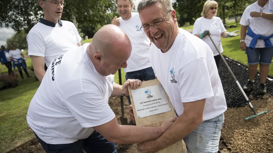 National Lottery Way unveiled at the National Memorial Arboretum National Lottery winners building the National Lottery Way