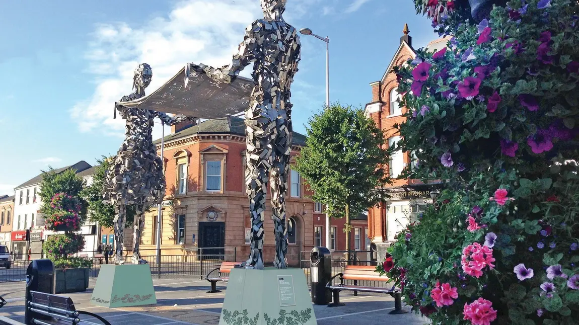 Metal statue of two people