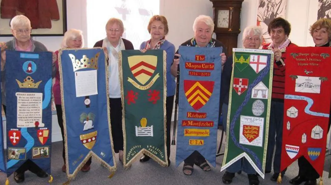 A group of project participants with banners