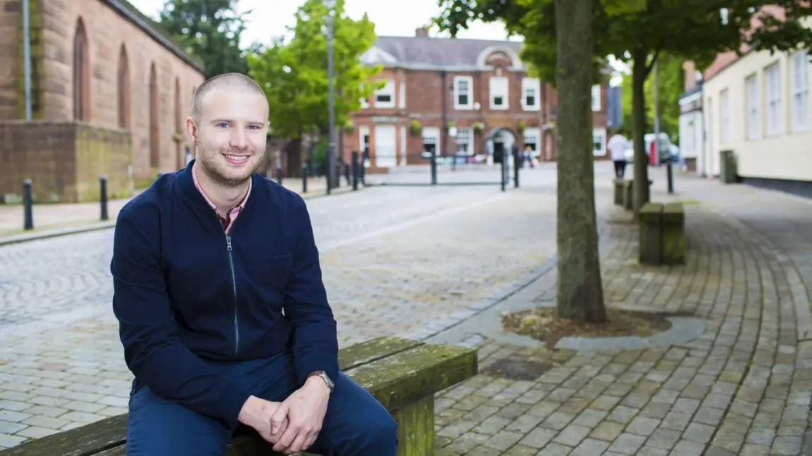 Daniel Longman sitting on a bench