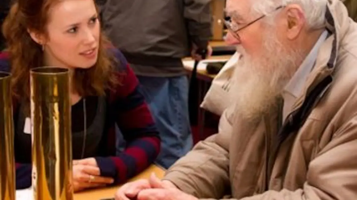 Discussing artefacts at the First World War Road Show, Morley Town Hall