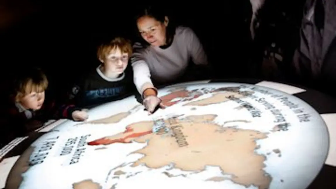 Children examine an exhibit at the National Army Museum Children examine an exhibit at the National Army Museum