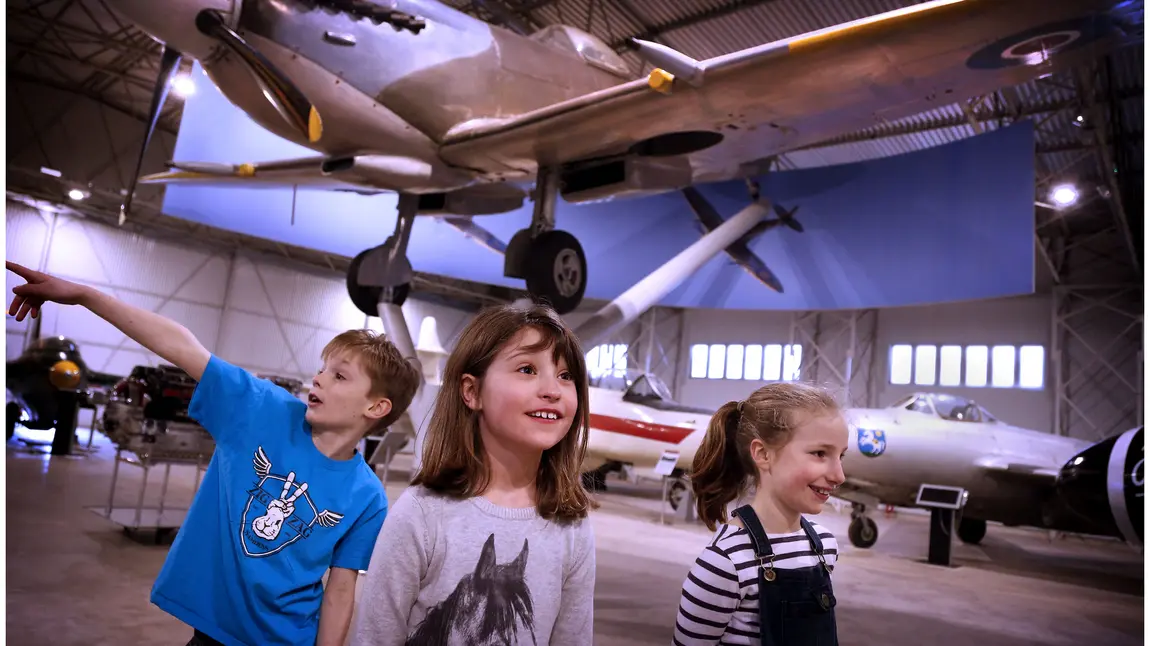 Children in front of a Spitfire