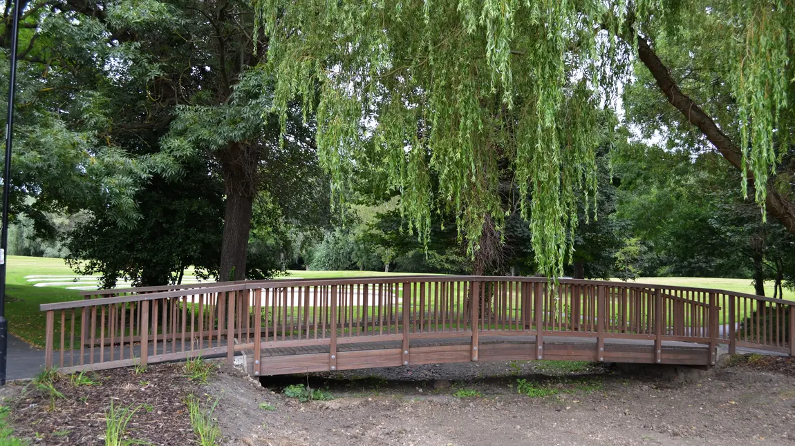Festival marks reopening of Walker Park A restored wooden bridge in Walker Park