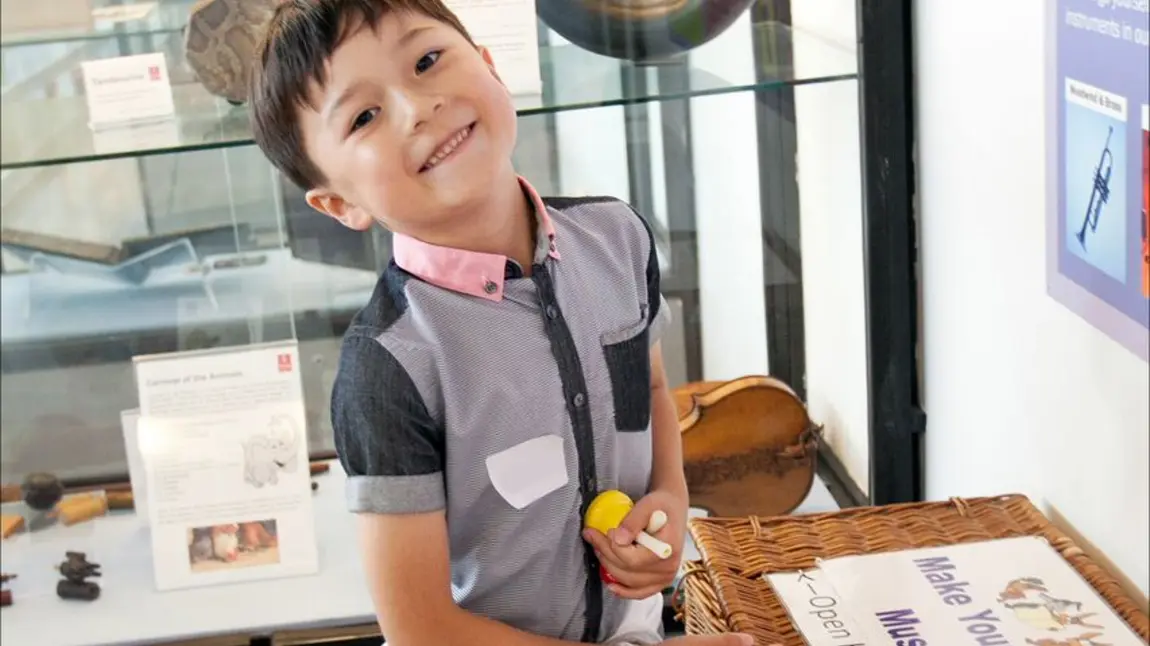 Child enjoying education activities of the Royal College of Music Museum 