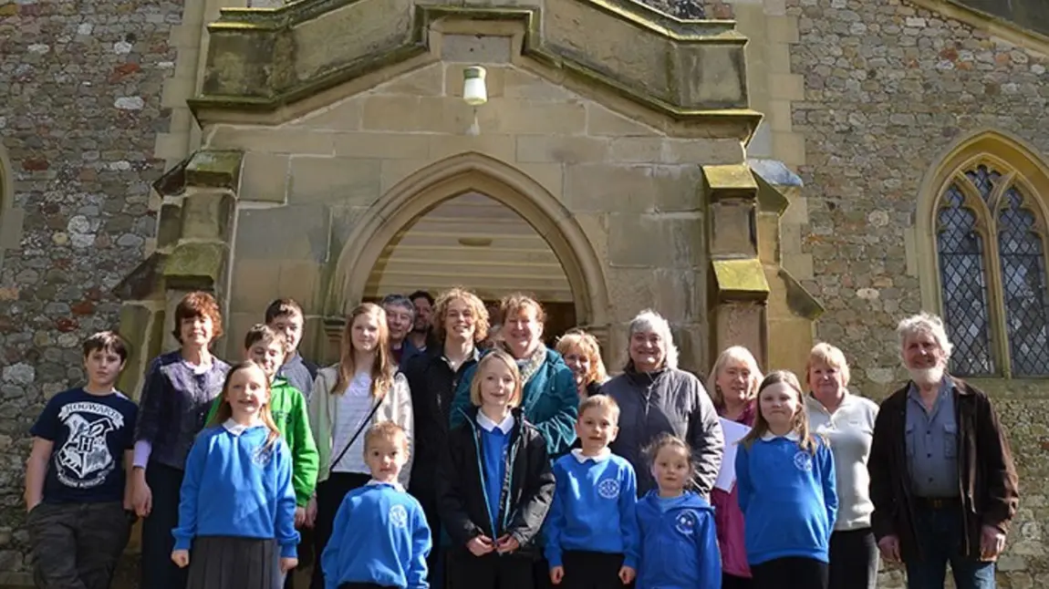 Local community of Roos celebrate their success outside All Saints Church, Roos