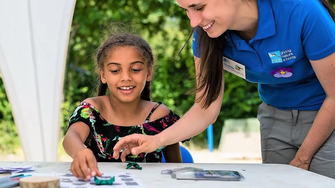 A young person enjoying activities at the nature reserve at Sandwell Valley RSPB