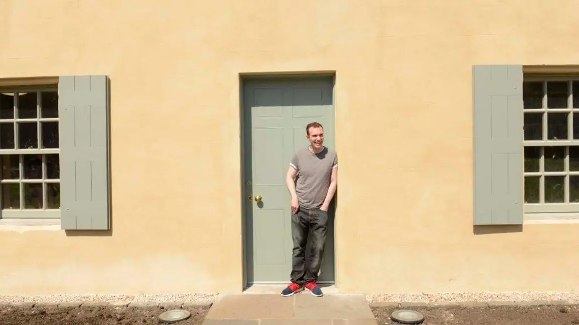 Sutherland Forsyth in front of the Botanic Cottage