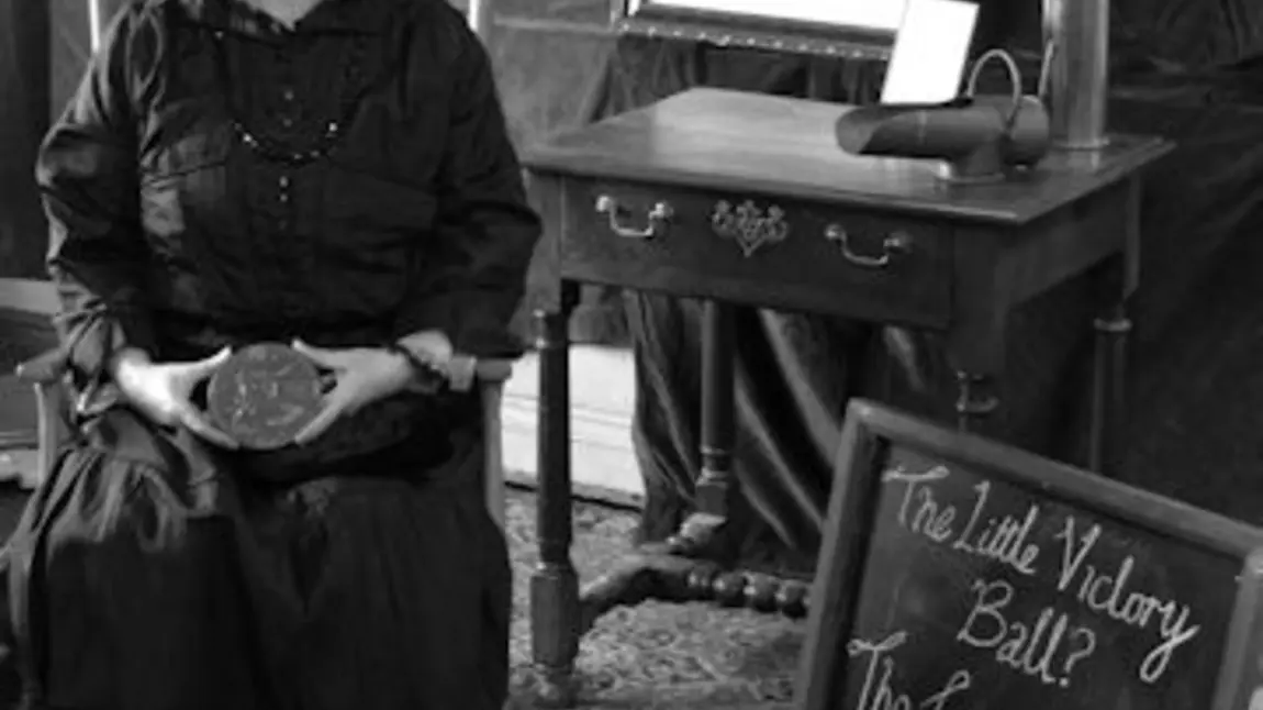 Photograph of widow in remembrance which forms part of the re-enactment project 'The Little Victory Ball' 