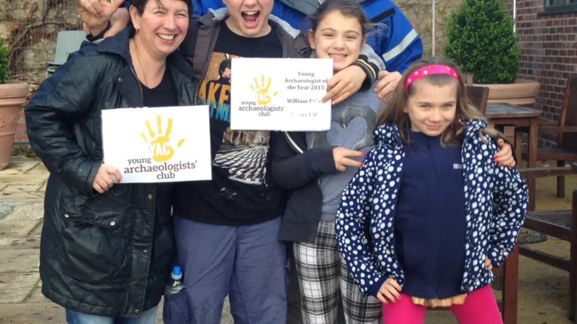 William celebrates becoming Young Archaeologist of the Year with his family