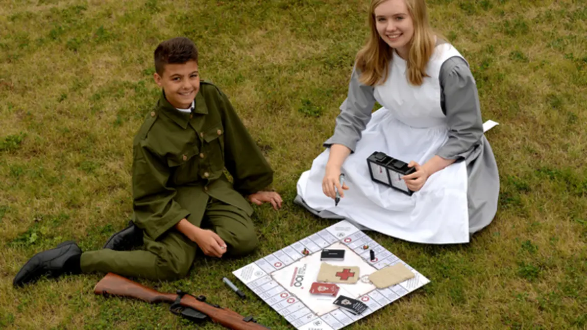 First World War board game launched Isaac Khan and Sophie Turbot in period costume with the First World War board game.