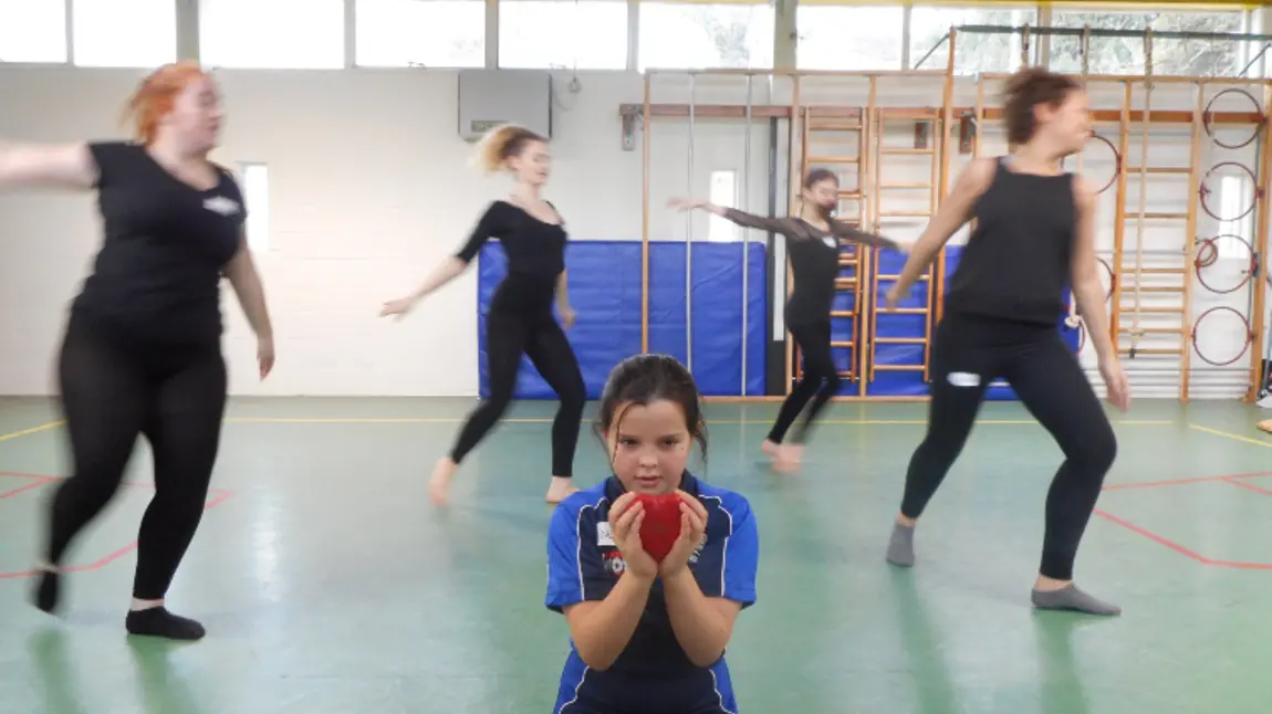 Hidden LGBT+ heritage uncovered thanks to National Lottery funding A young girl holds a heart surrounded by dancers