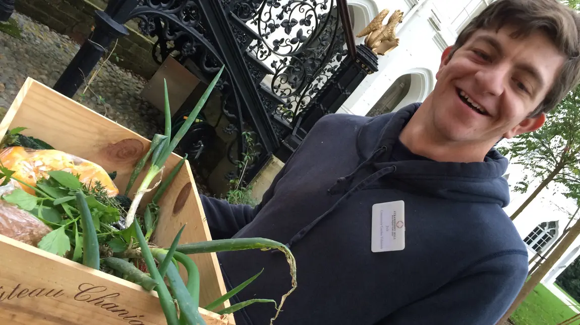 How volunteering can change lives Jack, volunteer at Strawberry Hill, carrying vegetable grown in the garden