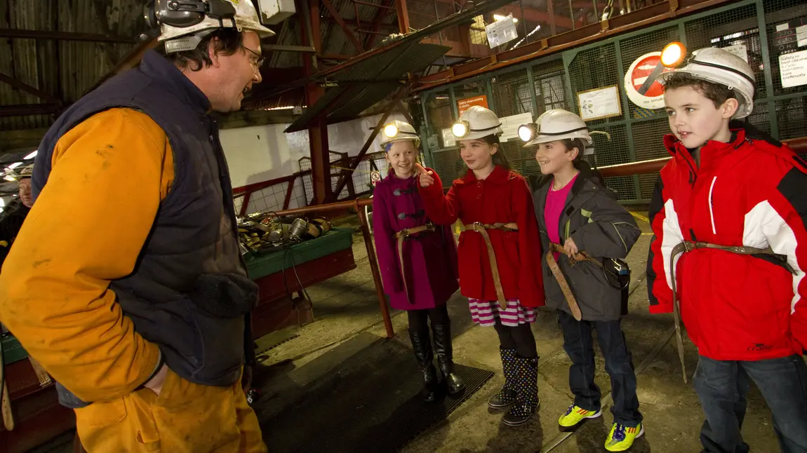 Heritage makes us happier A man teaches school children about mining heritage at the Big Pit National Mining Museum of Wales