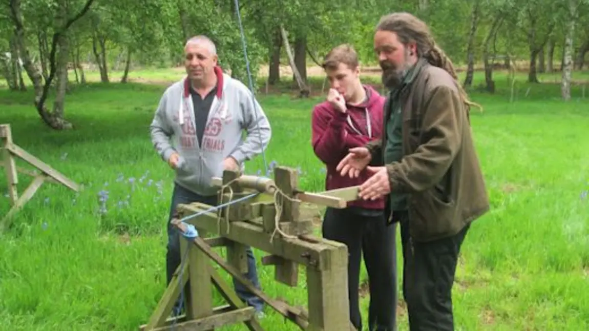 Young people learning about traditional building methods
