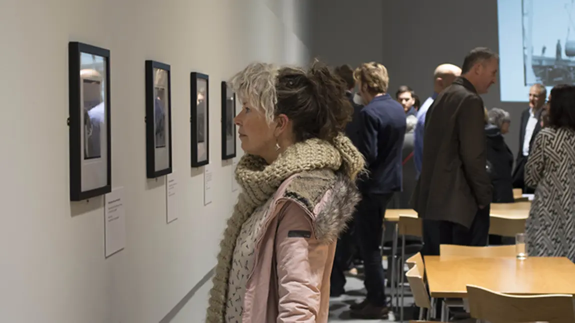 Visitors enjoy the opening of the exhibition