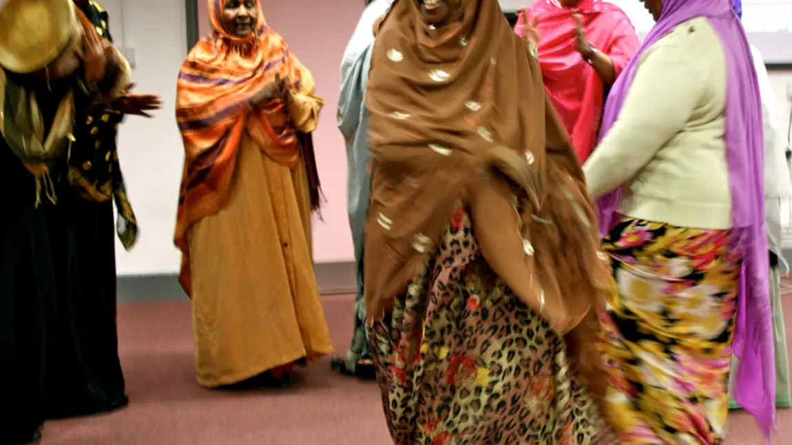 A group of people from Granby Somali Women's group stand in a circle