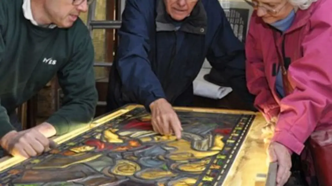 Participants examining a stained glass window at All Saint’s Church, Silkstone