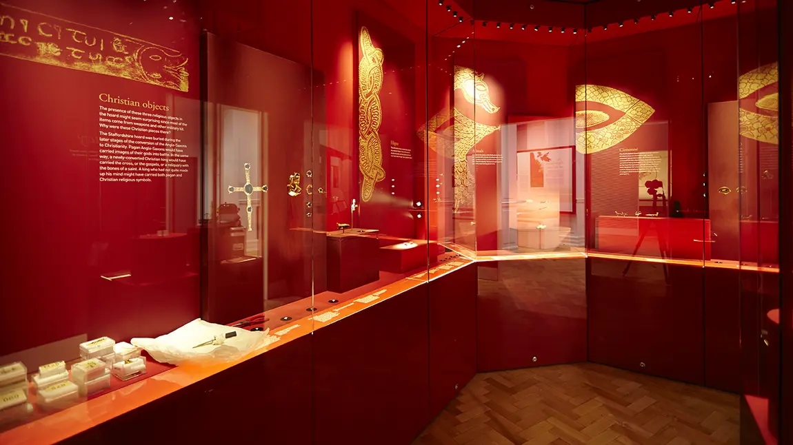 The Staffordshire Hoard Gallery with objects on display in glass cases
